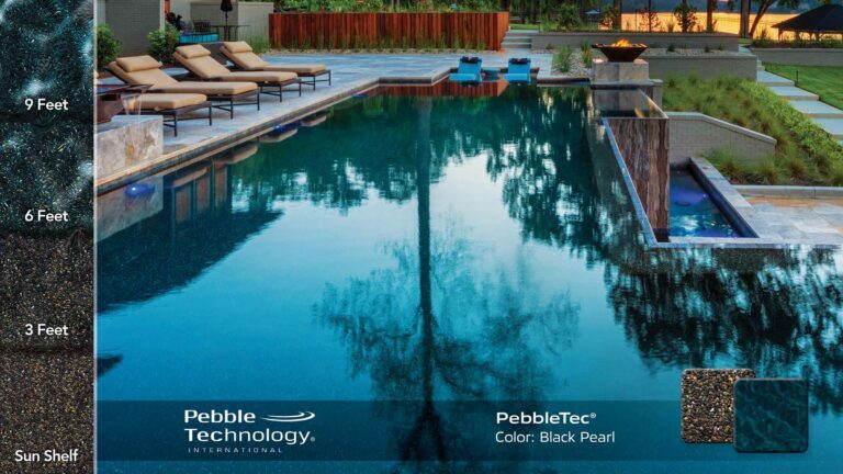 photo of backyard pool design with Fire and Water features in PebbleTec Black Pearl Pool Finish: deep brown pebbles with a speckling of white rocks produce a deep dark blue water color.