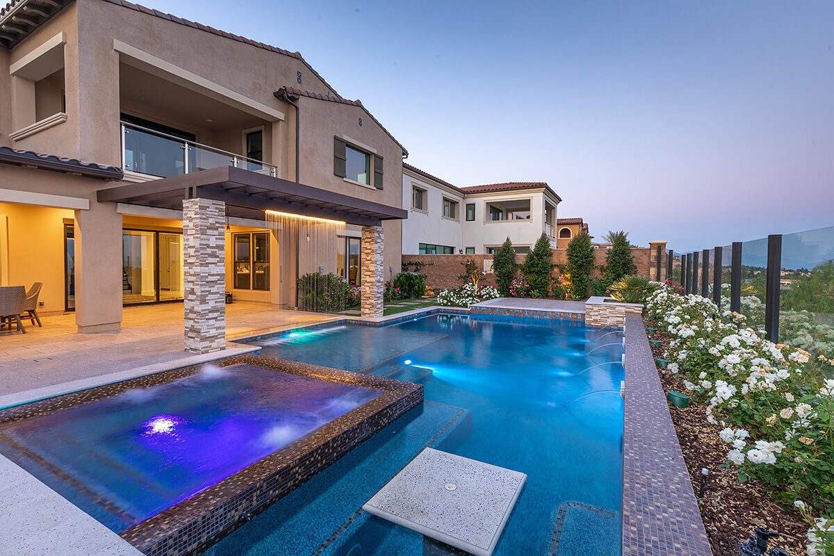 photo of a backyard pool design inPebbleTec PebbleBrilliance Clearwater Pool Finish medium blue water color with lightstreams tile features submitted for World's Greatest Pools 2021