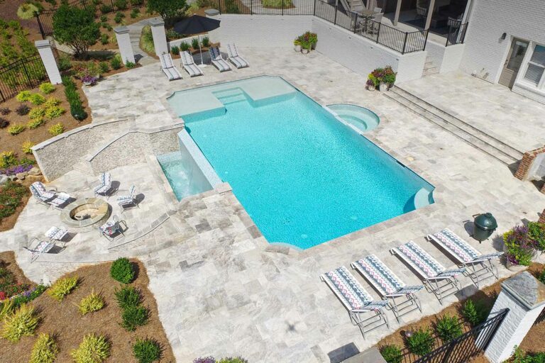 photo of a backyard pool design in PebbleTec Soft White Pool Finish light blue water color by Artistic Pools submitted for World's Greatest Pools 2018