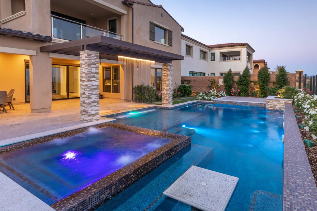 photo of a backyard pool design inPebbleTec PebbleBrilliance Clearwater Pool Finish medium blue water color with lightstreams tile features submitted for World's Greatest Pools 2021