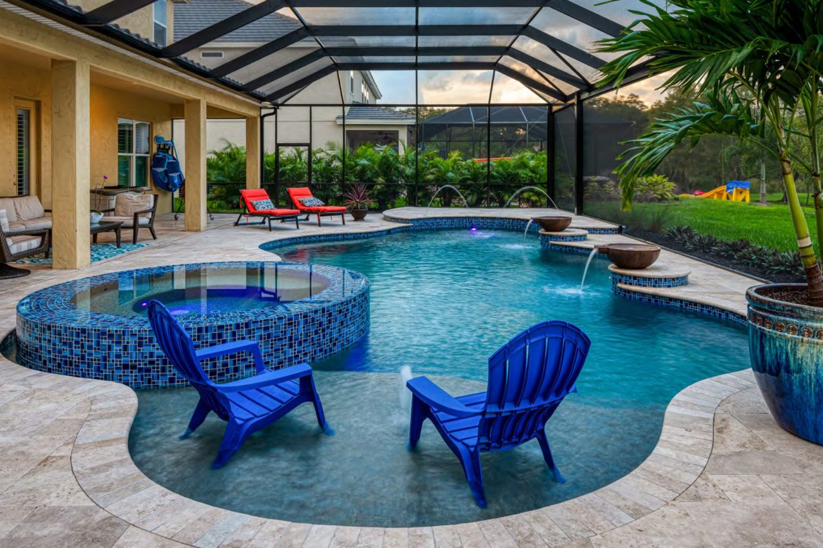 photo of a backyard pool design in enclosed greenroom in PebbleTec Tahoe Blue Pool Finish with water bowl features