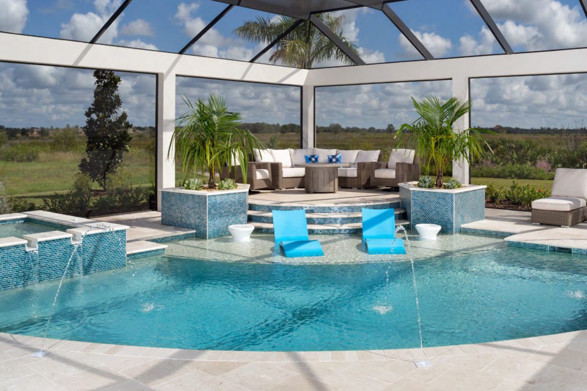 photo of a half circle pool with water features in PebbleTec White Pearl Pool Finish light blue water color with light streams tile features for World's Greatest Pools 2021