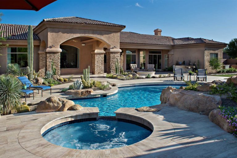 photo of a backyard pool and jacuzzi pool remodel with Lightstreams tile in PebbleBreeze Fresh Water Pool Finish water color