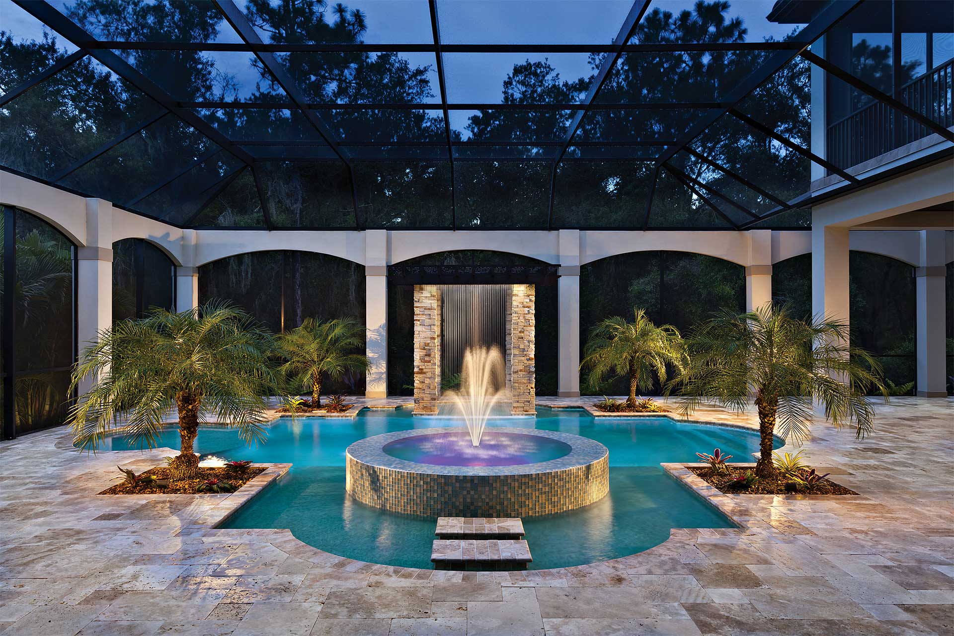 photo of backyard pool design in PebbleBreeze Silver Sea Pool Finish water color with a water feature and light streams tile by Gaetan Pools