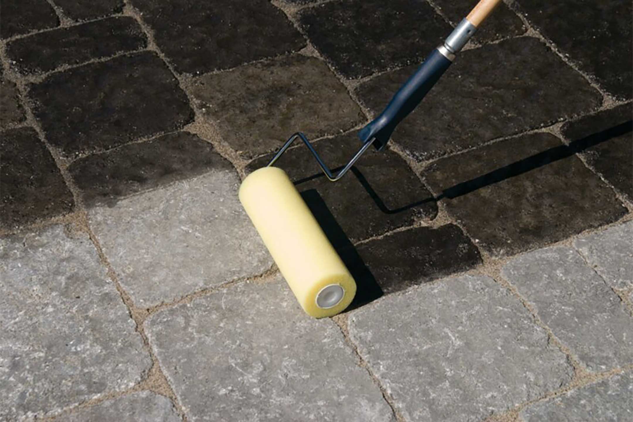Applying-sealer-on-pavers-with-roller_techniseal-hero-image