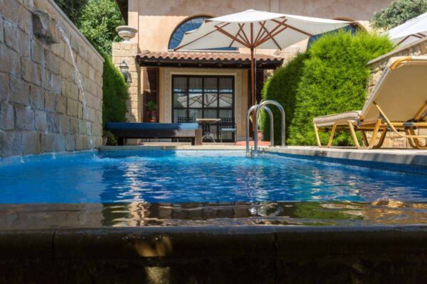 Private pool with water spout.