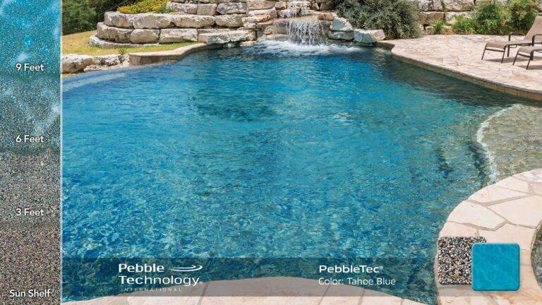 photo of backyard pool design in PebbleTec Tahoe Blue Pool Finish: Earthy gold and grey pebbles blended with dark brown stones produce a medium blue water color.