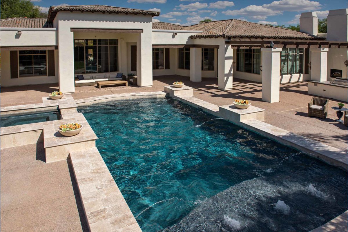 photo of a backyard pool design in PebbleTec PebbleBrilliance Majestic Sound Pool Finish medium blue water color