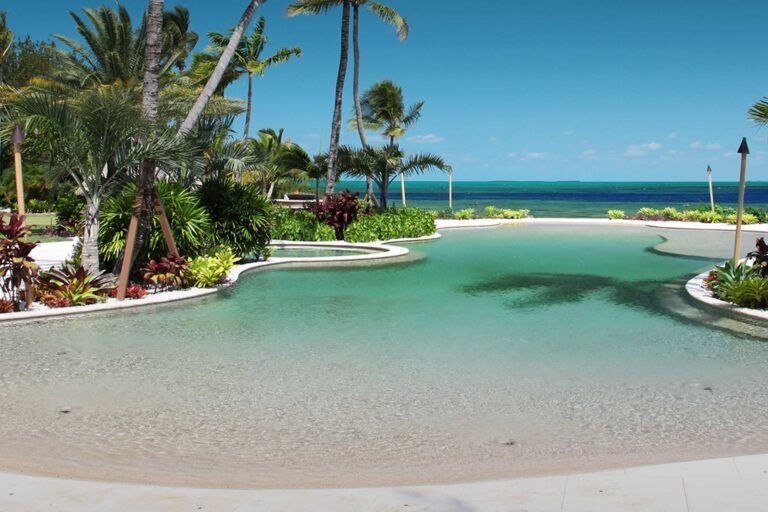 photo of a resort pool in PebbleTec Sandy Beach Pool Finish light green water color by Happy Hour Pools submitted for World's Greatest Pools 2014