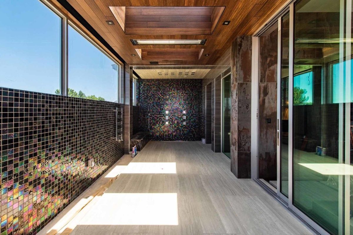 Photo of Absolute Black tile walk in shower and hallway