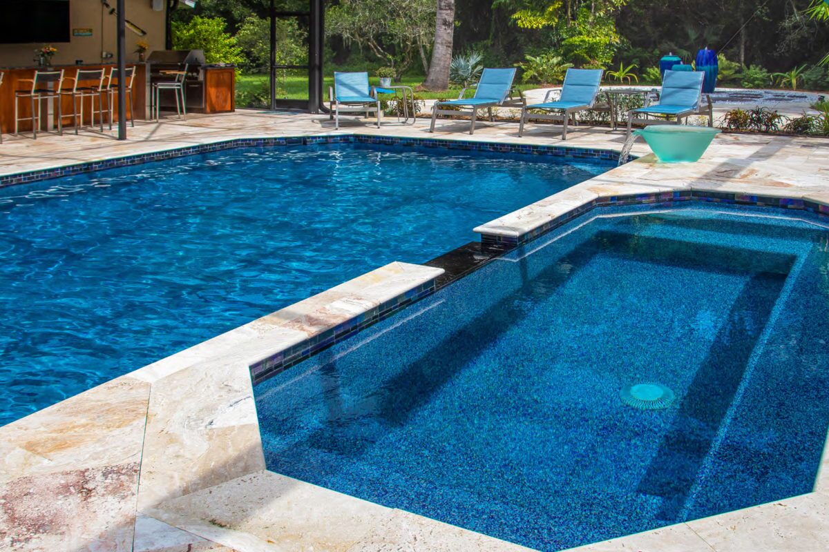 photo of a backyard pool in PebbleTec PebbleBrilliance Deep Cove Pool Finish medium blue water color submitted for World's Greatest Pools 2021