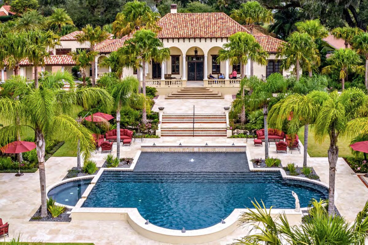 photo of a backyard pool design in PebbleTec PebbleBrilliance Majestic Sound Pool Finish medium blue water color at a mansion submitted for World's Greatest Pools 2019