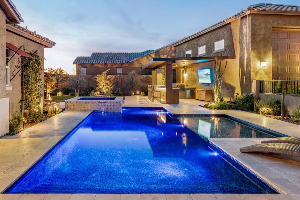 photo of a backyard pool design in PebbleTec PebbleBrilliance Tropicana Pool Finish medium to dark blue water color submitted for World's Greatest Pools 2019