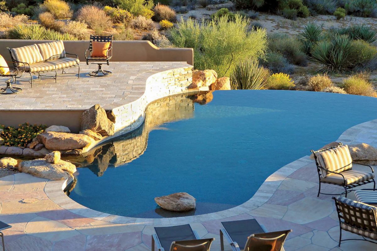 photo of a pool design in a desert in PebbleTec Sandy Beach Pool Finish medium blue water color for World's Greatest Pools 2015