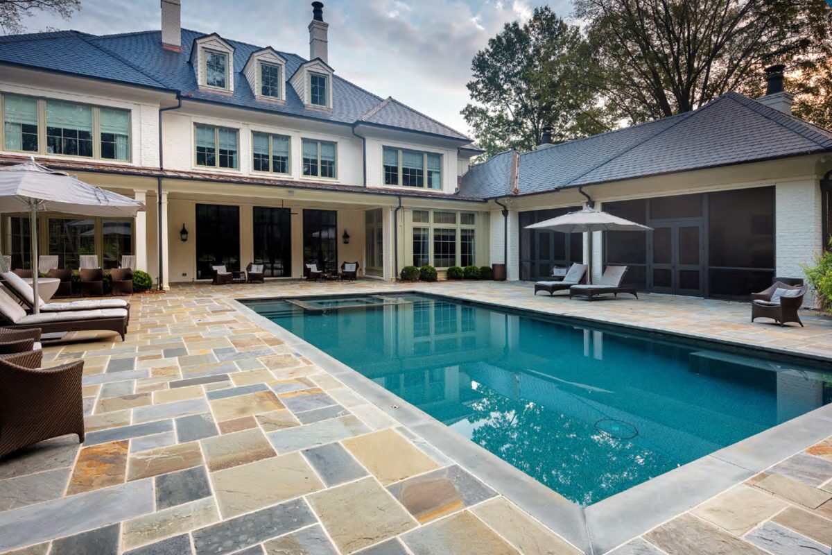 photo of a backyard pool design in PebbleTec Tropical Breeze Pool Finish medium blue water color