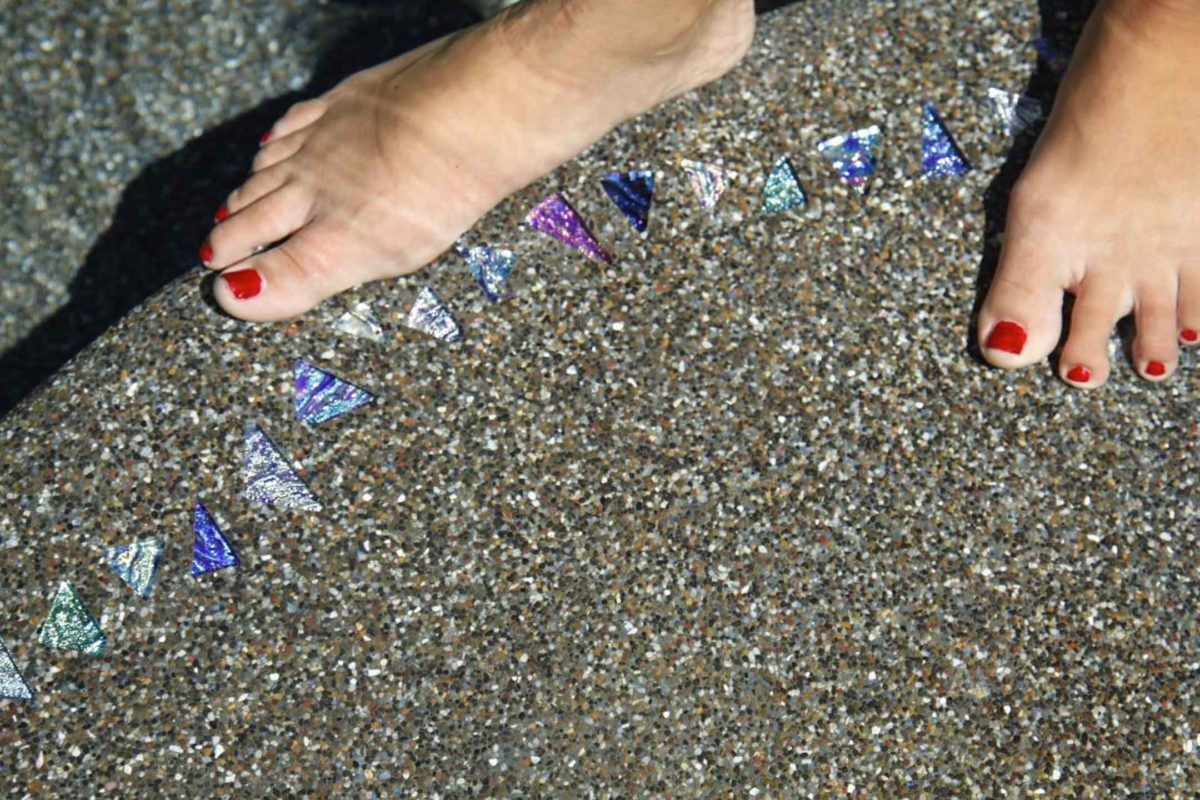 photo of Shell Beach Jewel step marker set in PebbleTec pool finish